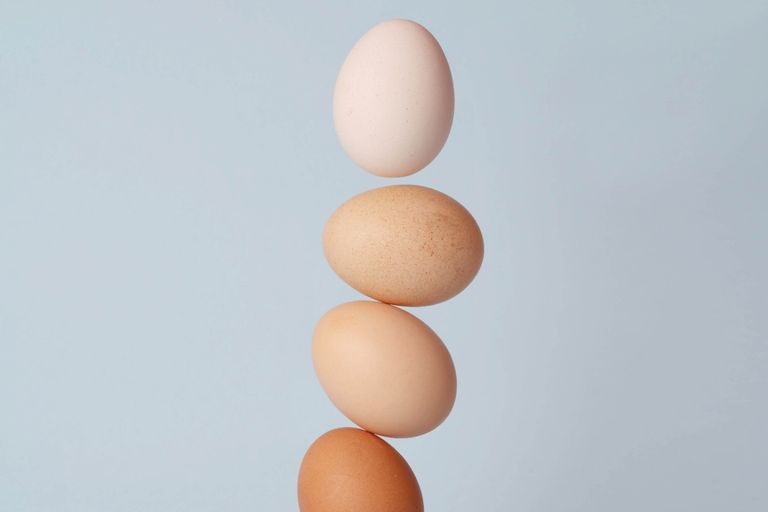 Eggs in different shades balanced on top of each other with a blue background, for Sarah Lord Physiotherapy and Wellbeing